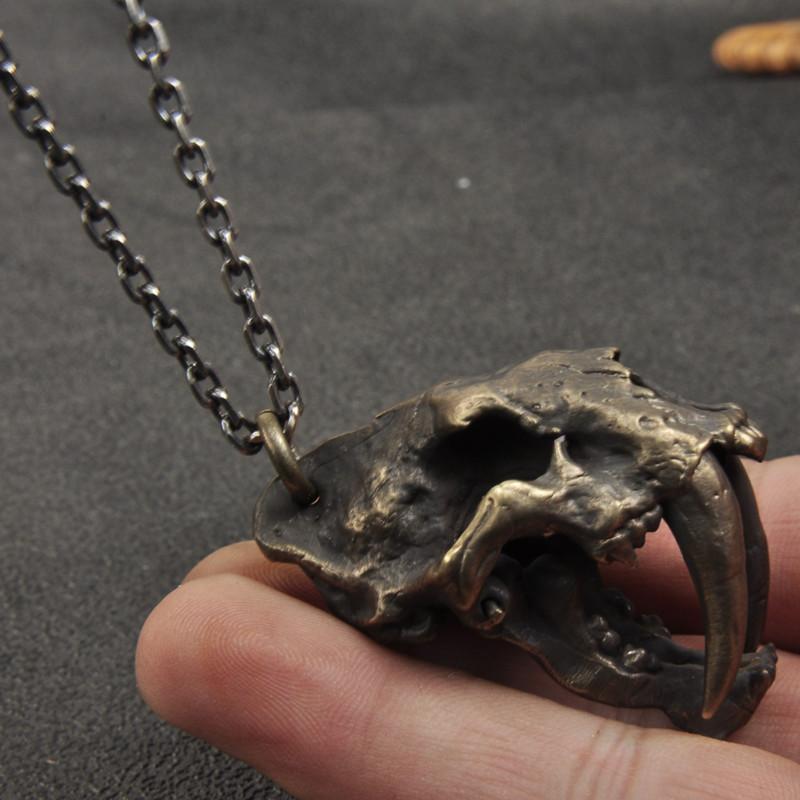 SABER-TOOTHED TIGER SKULL BRASS PENDANT