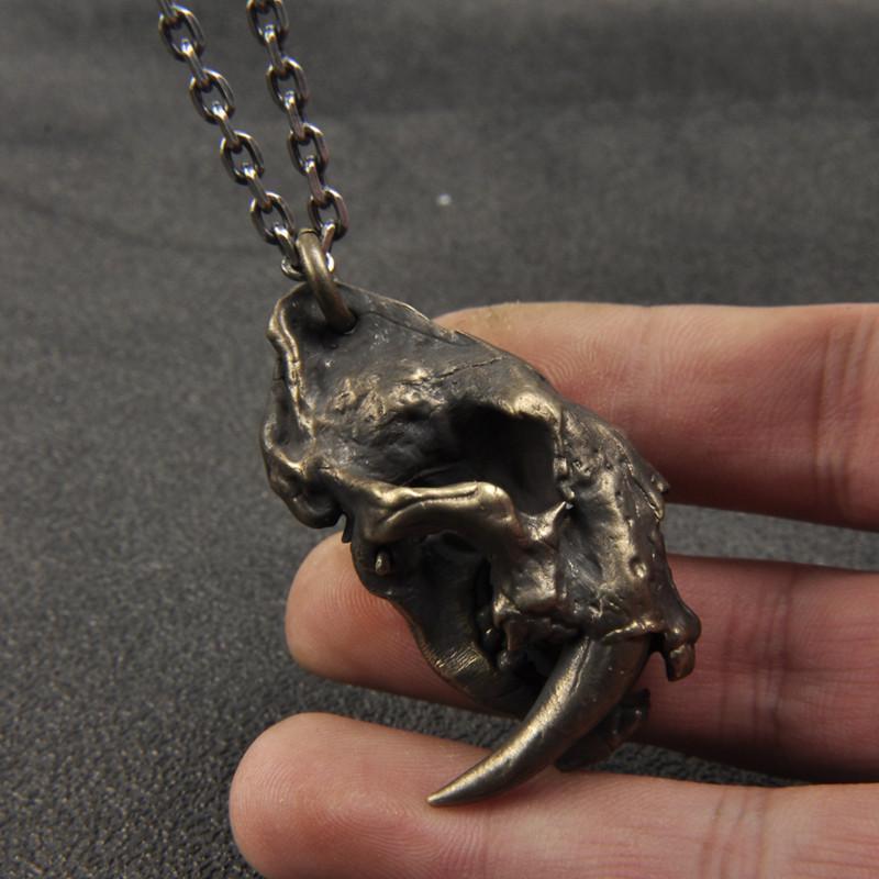 SABER-TOOTHED TIGER SKULL BRASS PENDANT