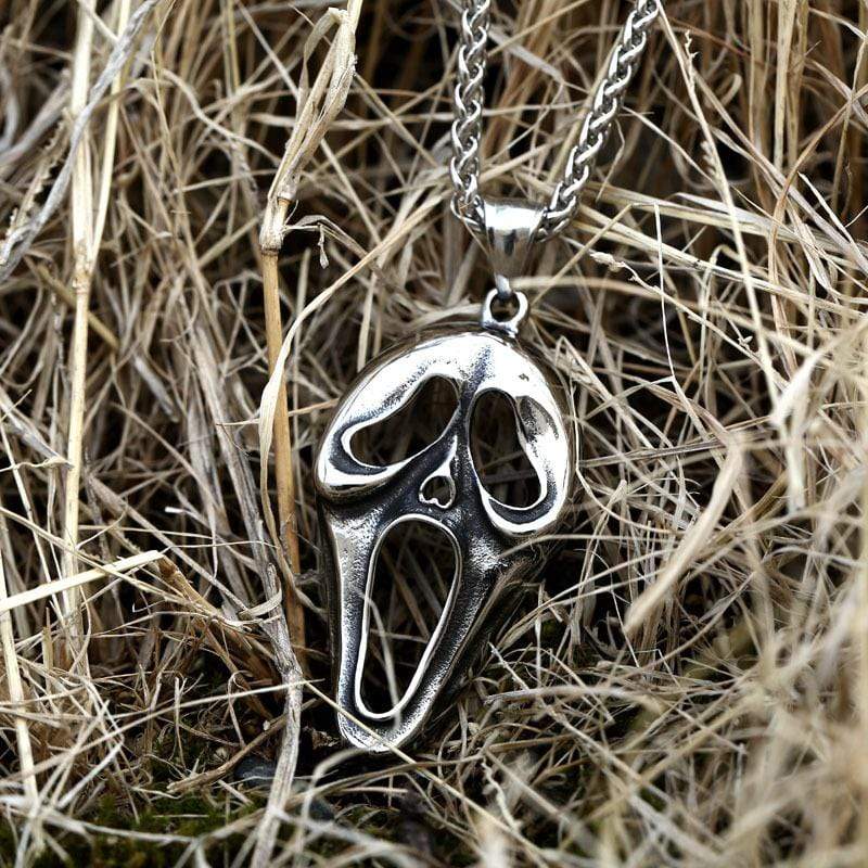COLGANTE DE ACERO INOXIDABLE CON CARA DE CALAVERA DEFORMADA