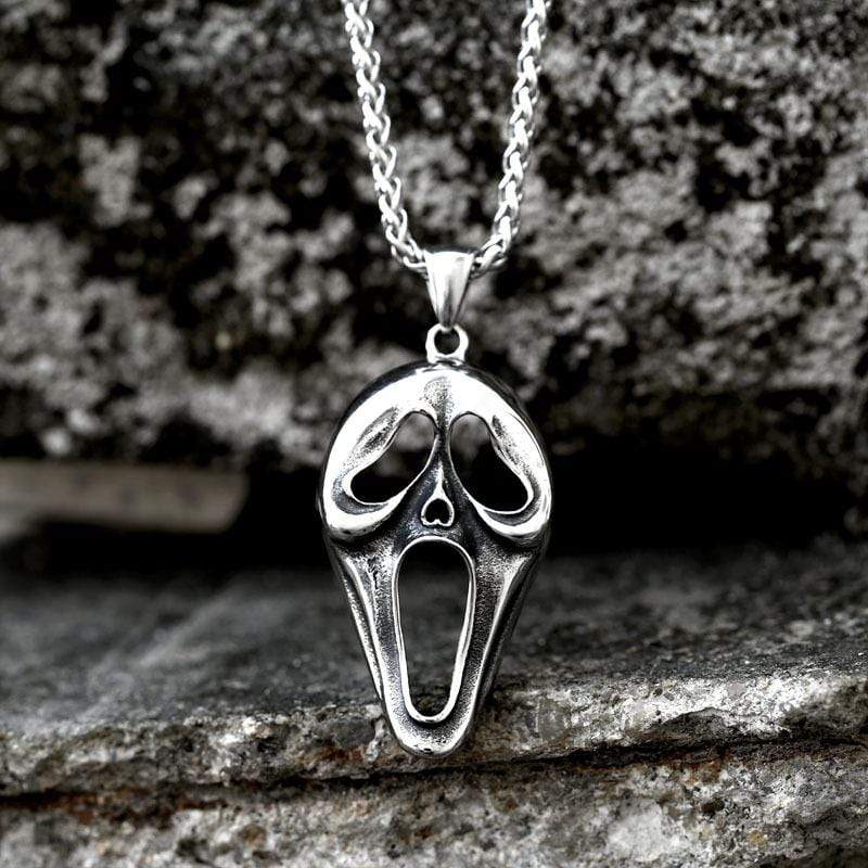 COLGANTE DE ACERO INOXIDABLE CON CARA DE CALAVERA DEFORMADA
